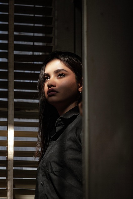 woman - wooden blinds 