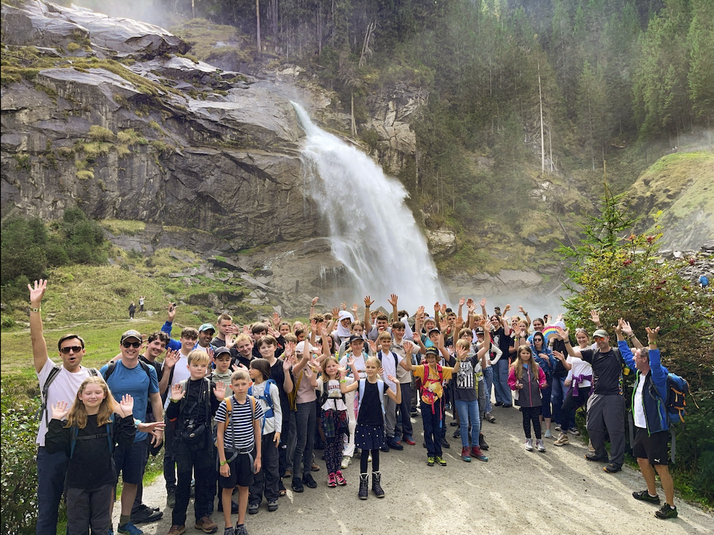 Online students at SBL gather under stunning waterfall