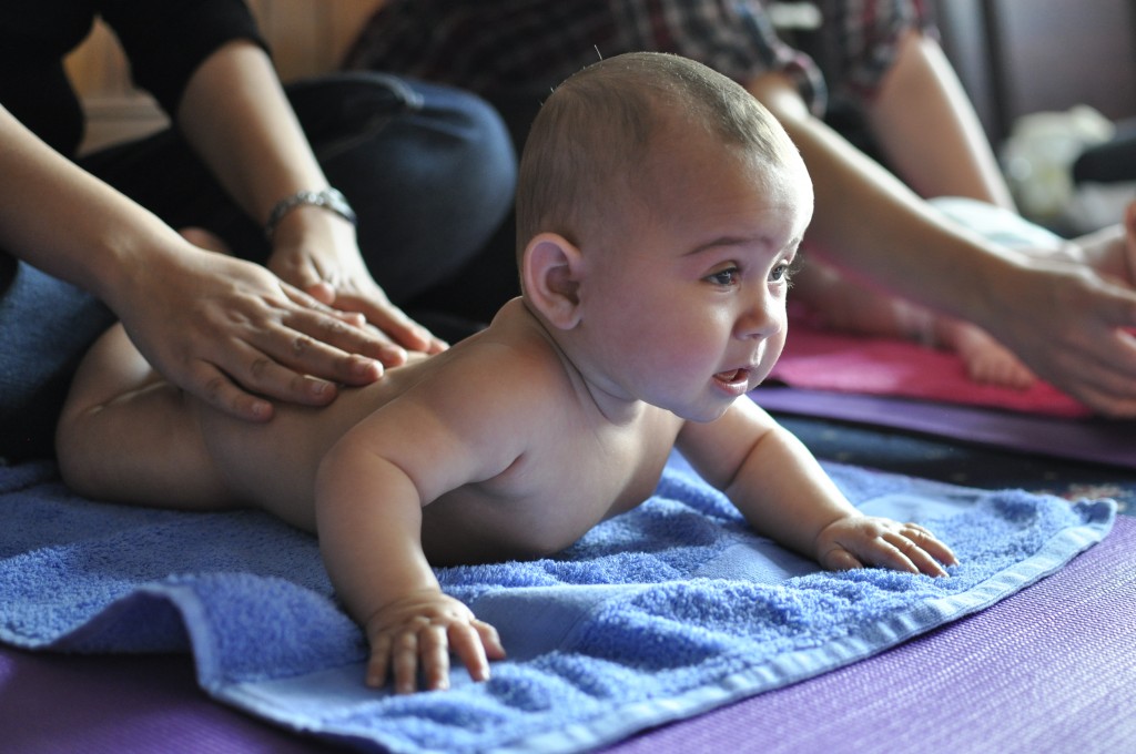 baby practising yoga poosing for mums magazine