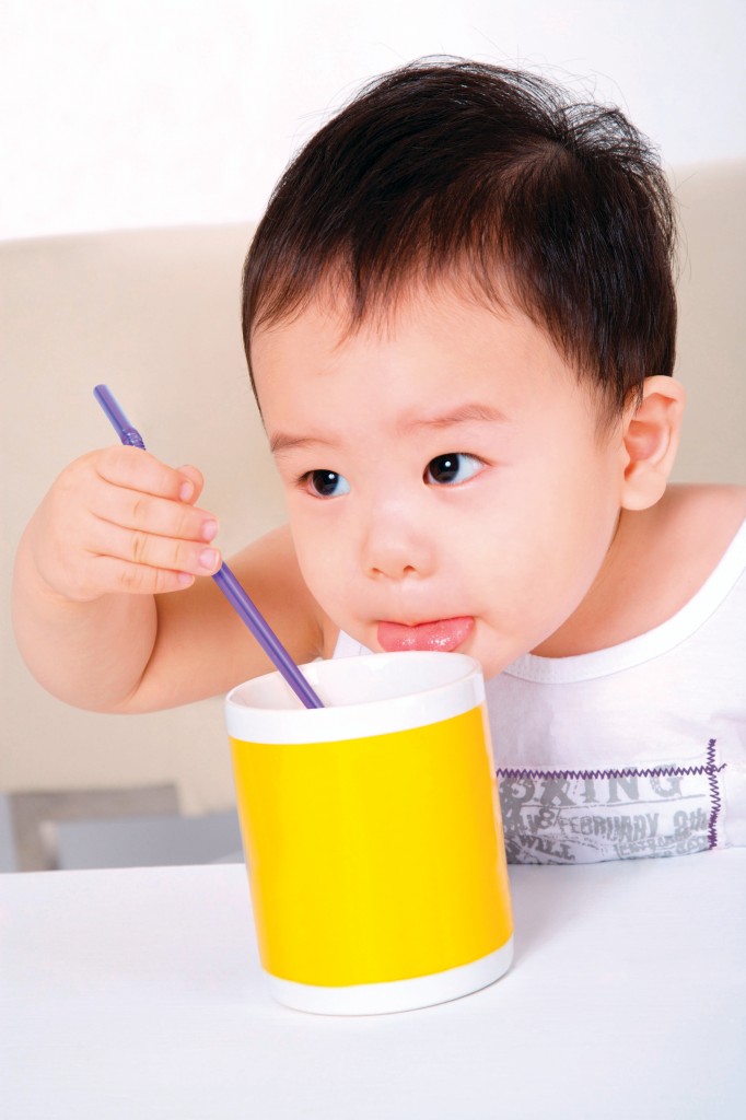 Baby boy eating food portrait