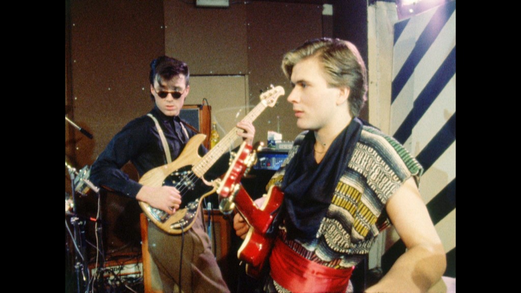 Steve Norman of Spandau Ballet wearing 80s shirt posing for mums magazine 