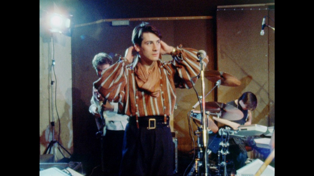 Tony Hadley of Spandau Ballet wearing 80s shirt  posing for mums magazine