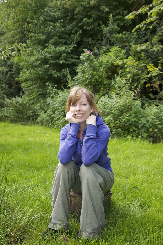woman wearing blue jumper posing for mums magazine