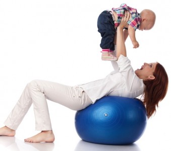Happy family with fitness ball.