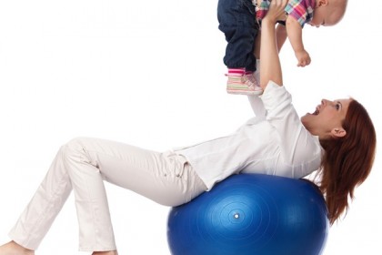 Happy family with fitness ball