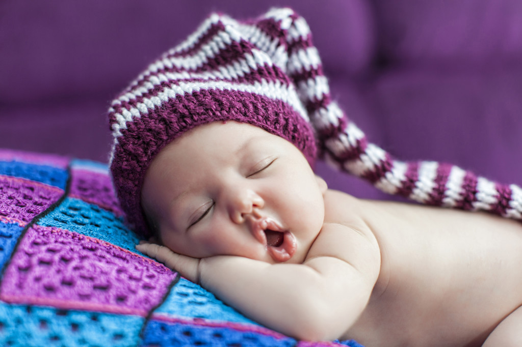 Dreams Baby sleeping purple background