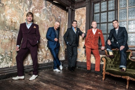 Spandau Ballet wearing elegant suits posing for mums magazine
