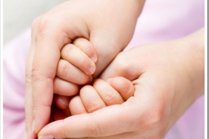 London Mums magazine mother and baby hands make a heart shape love