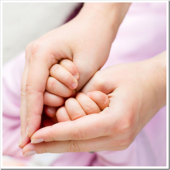 London Mums magazine mother and baby hands make a heart shape love