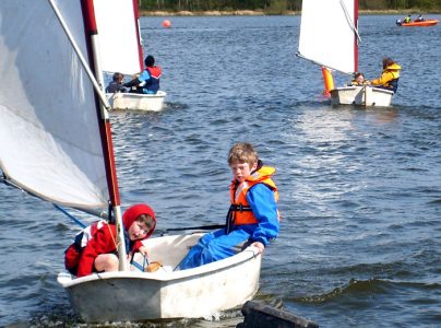 Top 10 Things to do this summer with Kids Who Love Water KIDS IN BOAT