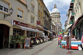 street Rue de Lille in Boulogne in France with bars and church