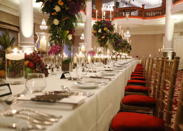 dinner table and red chairs set as in 1953 Coronation Dinner re-interpreted by Chef Alexander Boyd to celebrate tv series The Crown