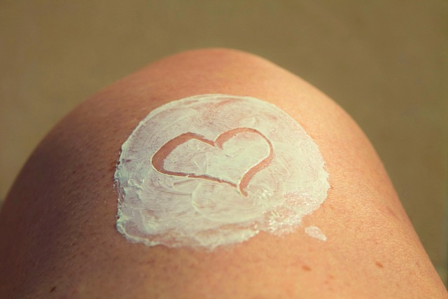 leg with suncream and a heart shape drawn on it