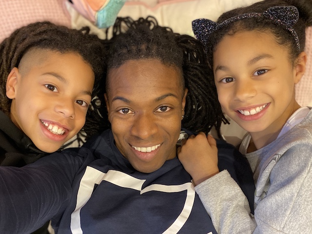 Nigel Clarke with his kids smiling and posing for mums magazine 