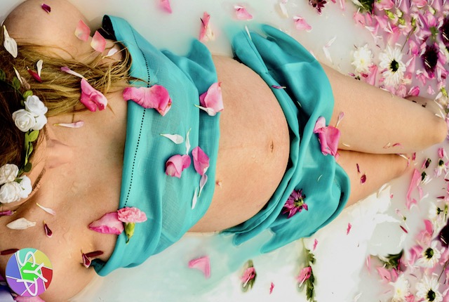 pregnant woman wearing a two piece bikini posing for mums magazine