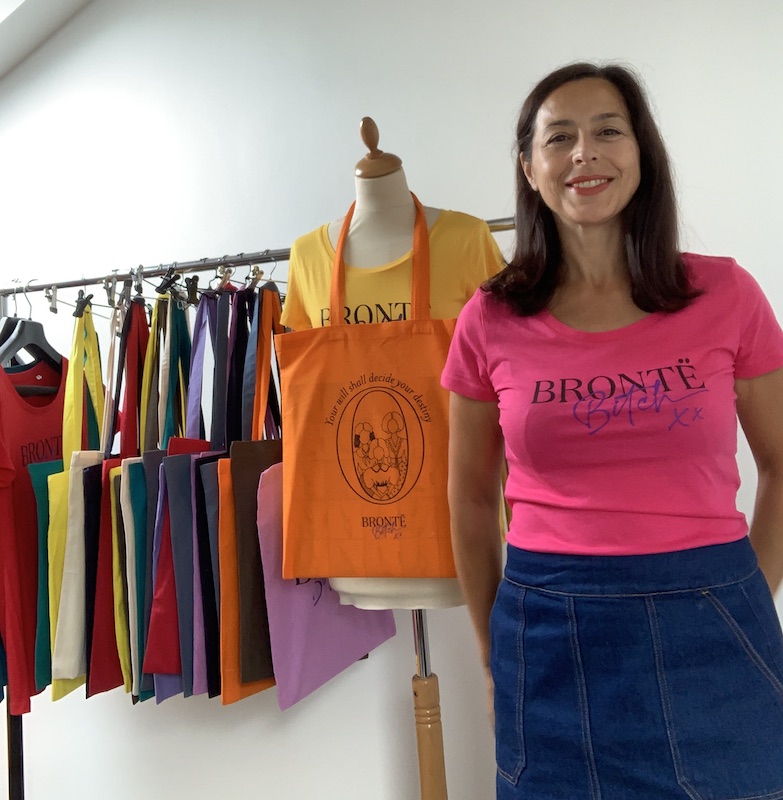 Rosalia Ferrara wearing a fuchsia shirt with the writing bronte bitch posing for mums magazine