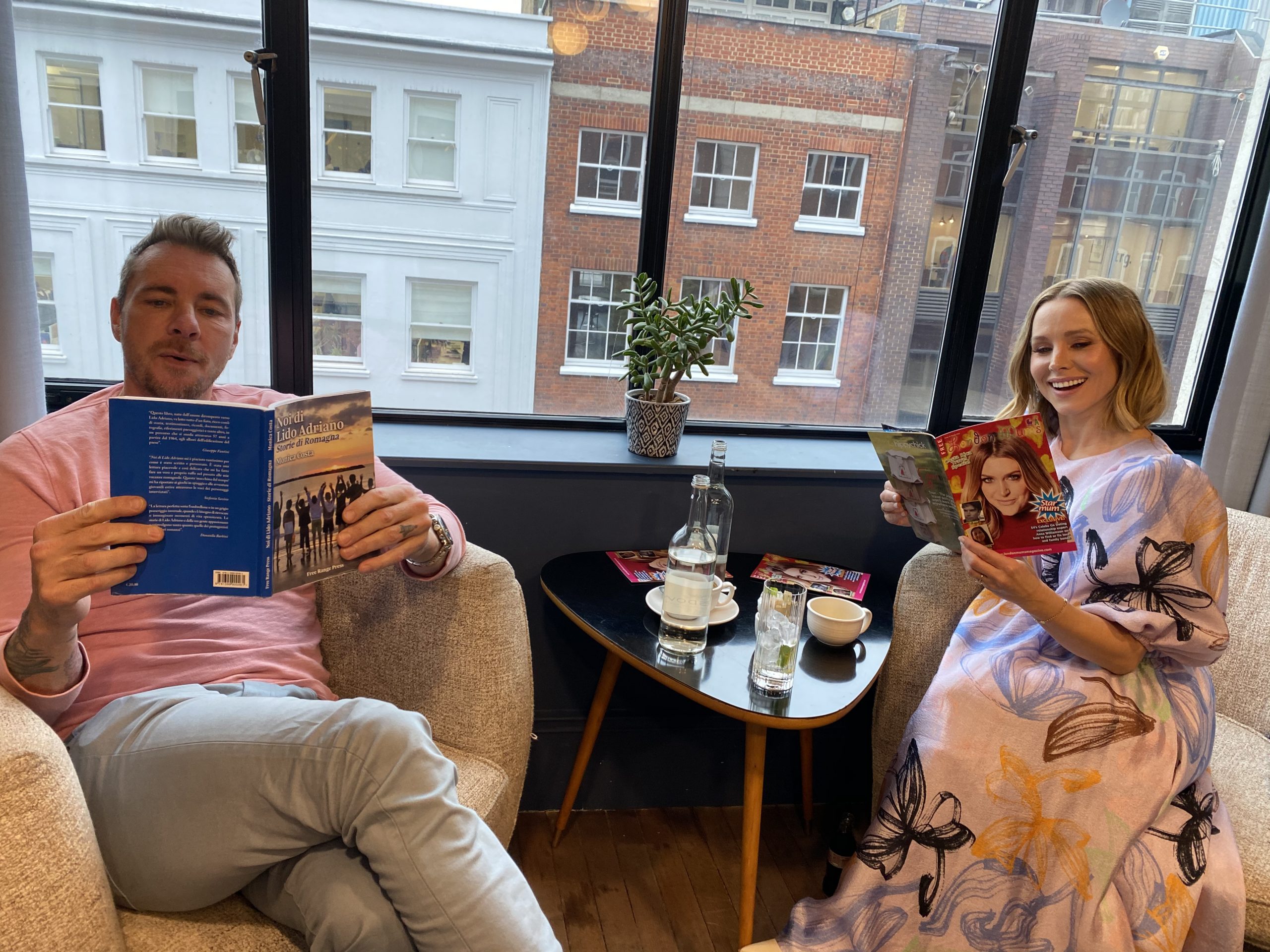 Kristen Bell and Dax Shepard in London reading mums magazine and book about holidays in Italy