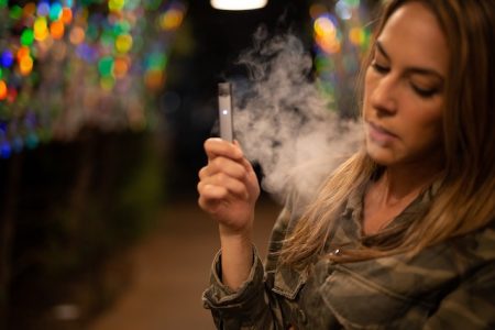 blonde young woman vaping