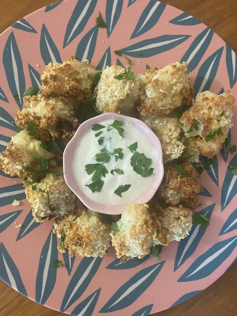 cauliflower bites on a pink plate 
