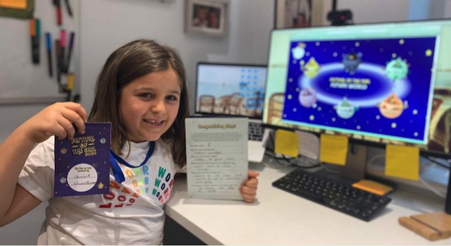 girl at computer at Festival of The Girl posing for mums magazine
