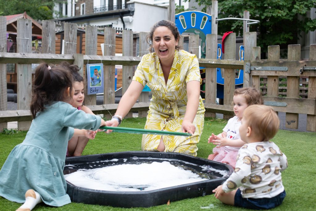 mum playing with babies and toddlers posing for mums magazine