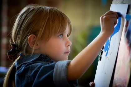 child practising handwriting