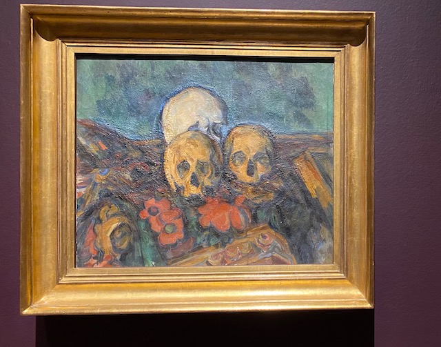 cezanne painting of skulls on a table still life
