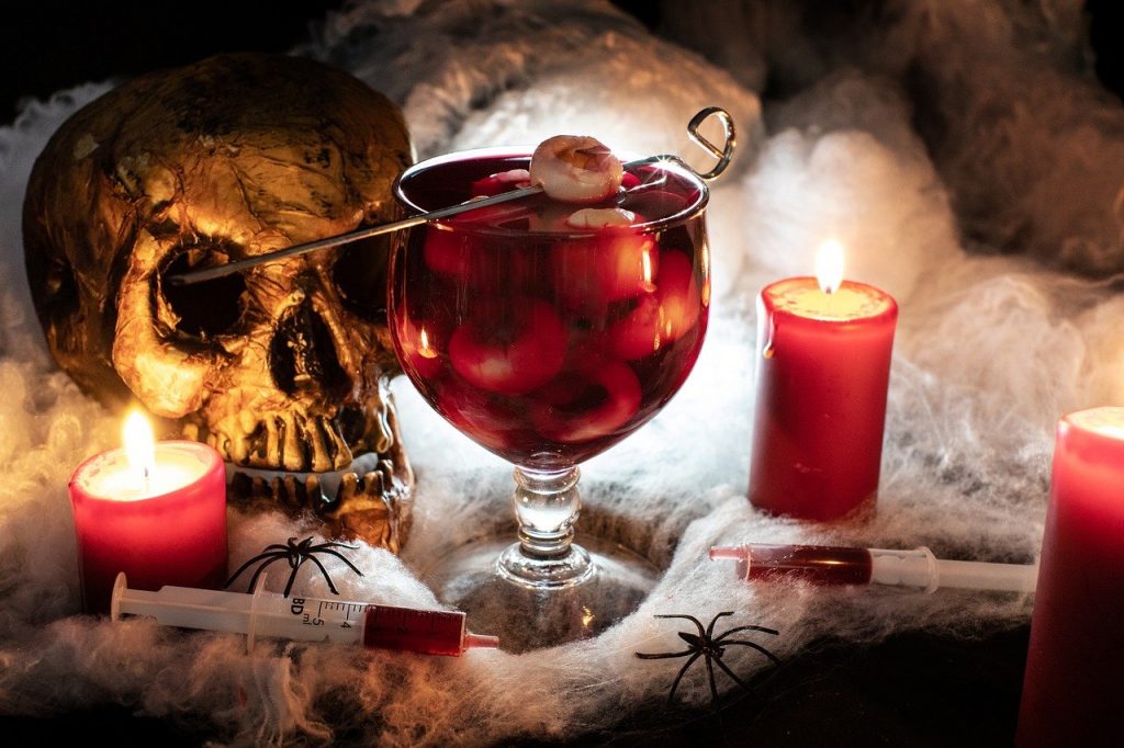 halloween cocktail with red juice and skull decoration