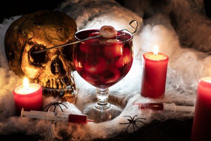 halloween cocktail with red juice and skull decoration