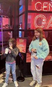 two girls posing for mums magazine at the cinema