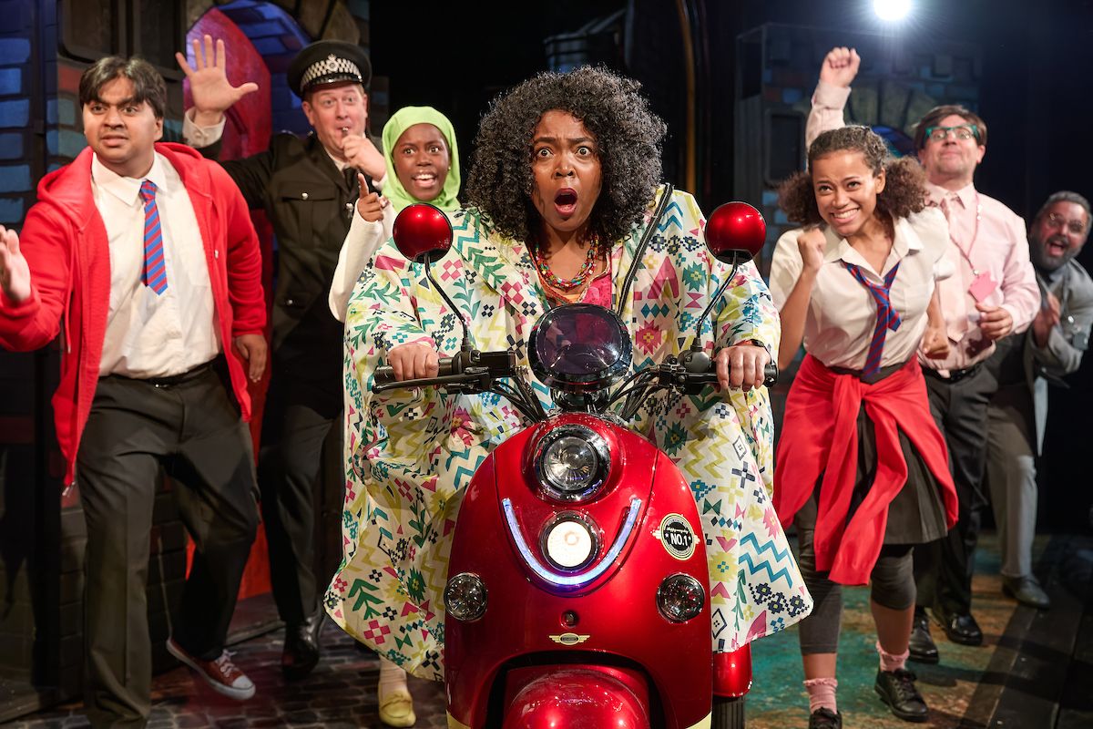 full cast posing with red Vespa motorbike on stage of Show Demon Dentist written by David Walliams