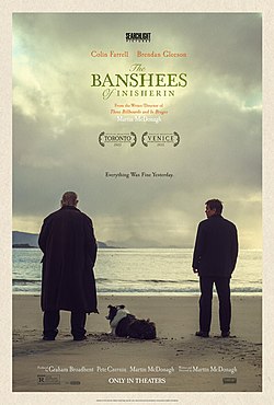 The Banshees of Inisherin movie poster showing two men and a dog on a beach looking at the sea