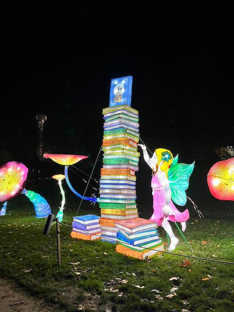 lightopia christmas lights in the shape of a tower made of books 