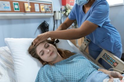 Woman in hospital bed receiving inpatient treatment