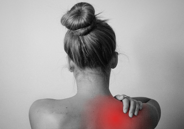 woman's back with shoulder pain