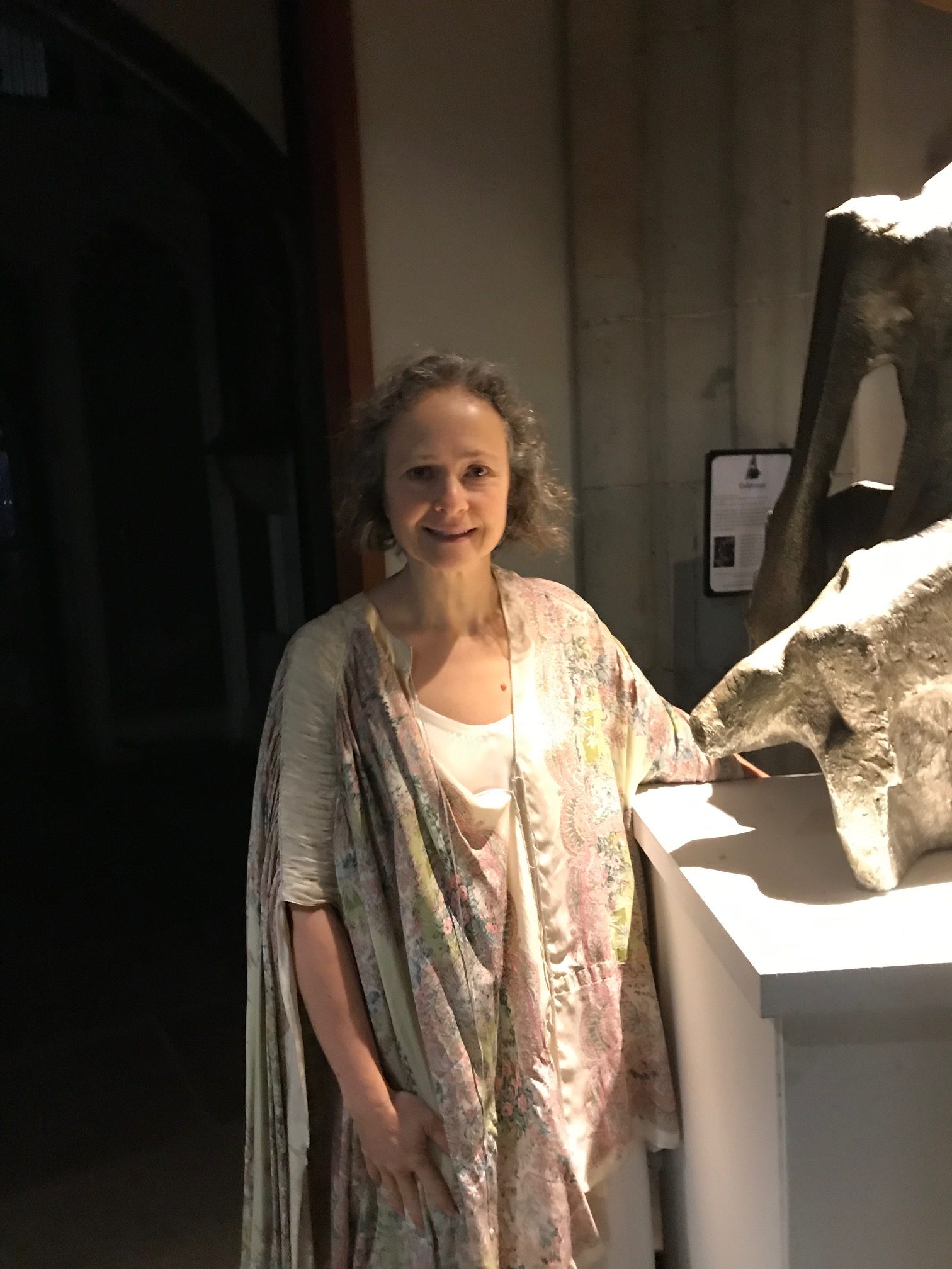 Madeleine wears a light coloured dress while posing for mums magazine