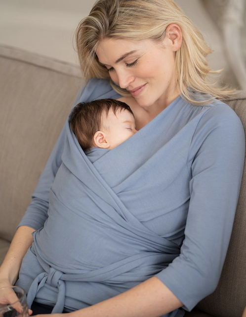 mum wearing a seraphine breastfeeding top while holding her sleeping baby