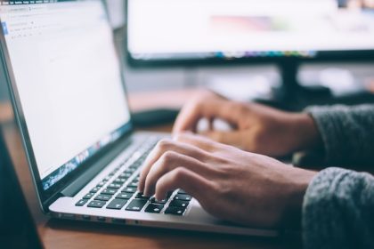 person writing a will on the computer