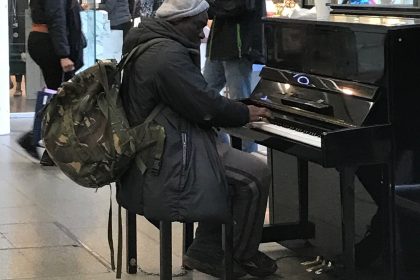man playing the piano at st pancreas