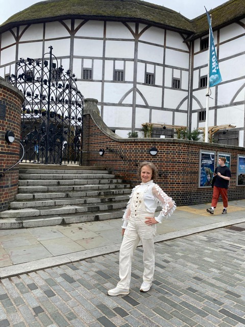 Madeleine in labourer's overalls with a hint of fairy woodland...