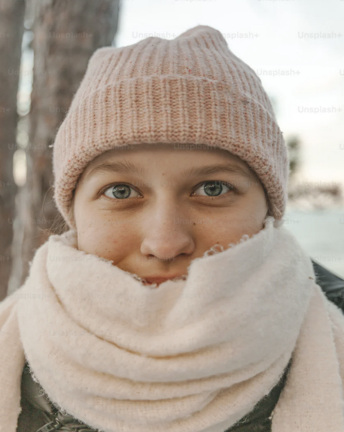 mum with hat Mum's winter school run essentials: Stay prepared and comfortable in the cold