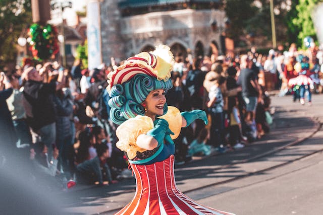 crowd of people watching woman performing at Florida Disney world 