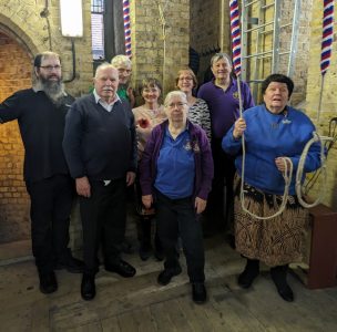 Photo caption: Members of the Surrey Association bell installation volunteer crew; (left to right) Nick Rata, Michael Uphill, Anthony Rands, Millica Reardon, Anthea Rata, Colette Shrier, Andrew Fisher, Charlotte Kirwan: ‘I’ve been here from the beginning.’