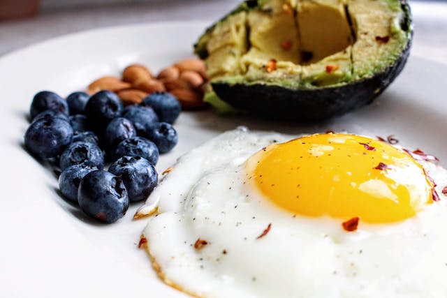 egg near blueberries and avocado 