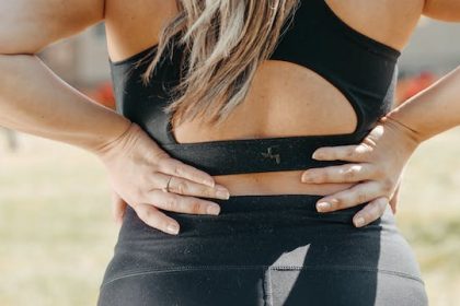 Photo by Kindel Media: https://www.pexels.com/photo/a-woman-wearing-black-active-wear-holding-her-waist-7298412/