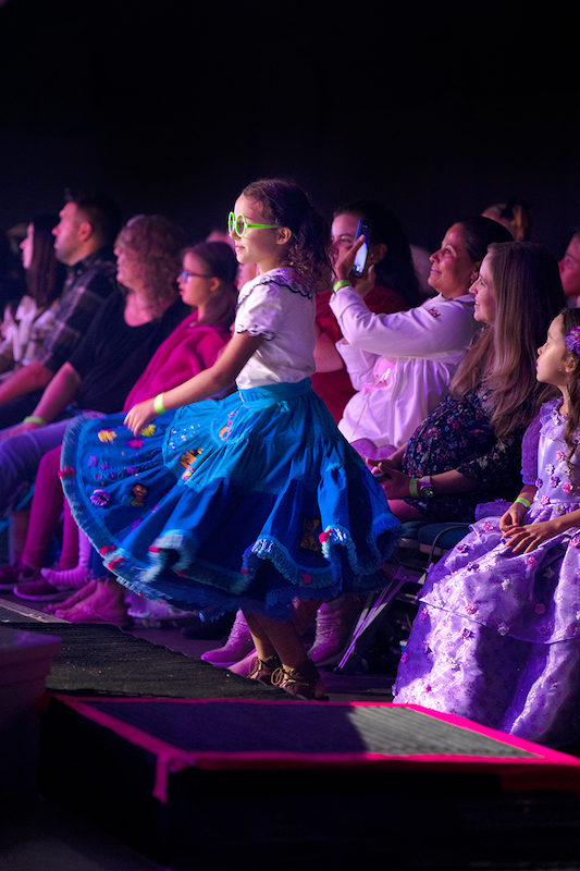 disney on ice london girl dancing in the audience 