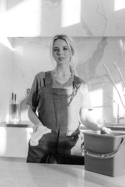 woman in apron black and white photo