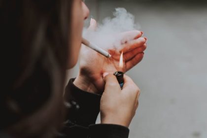 woman smoking - Photo by lil artsy