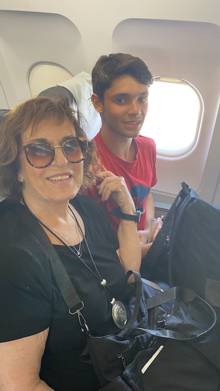 grandmother and grandson on an aeroplane - Air travel with glasses or contacts