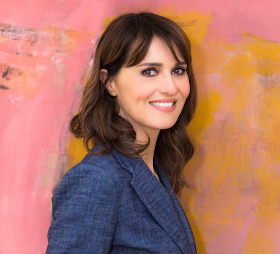 Paola Cortellesi posing for mums magazine on bright backdrop